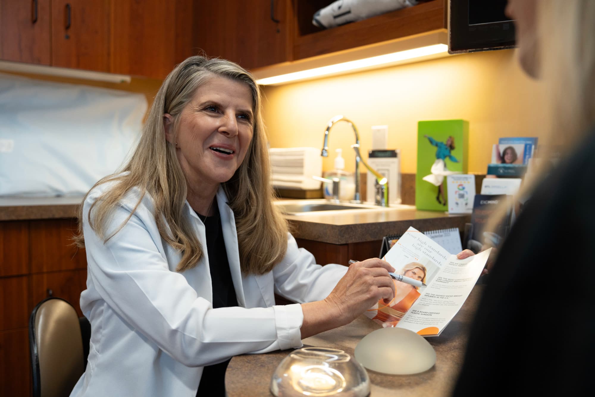 Dr. Harrington meeting with a patient during a consultation