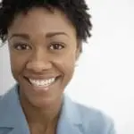 smiling woman in blue shirt