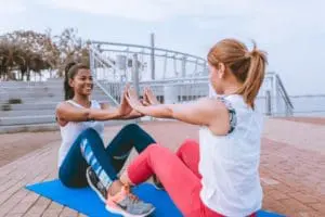 Two women working out together.