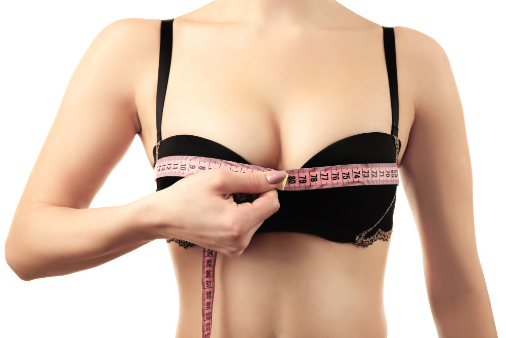 Harrington - Breast Augmentation - Woman measuring with a tape